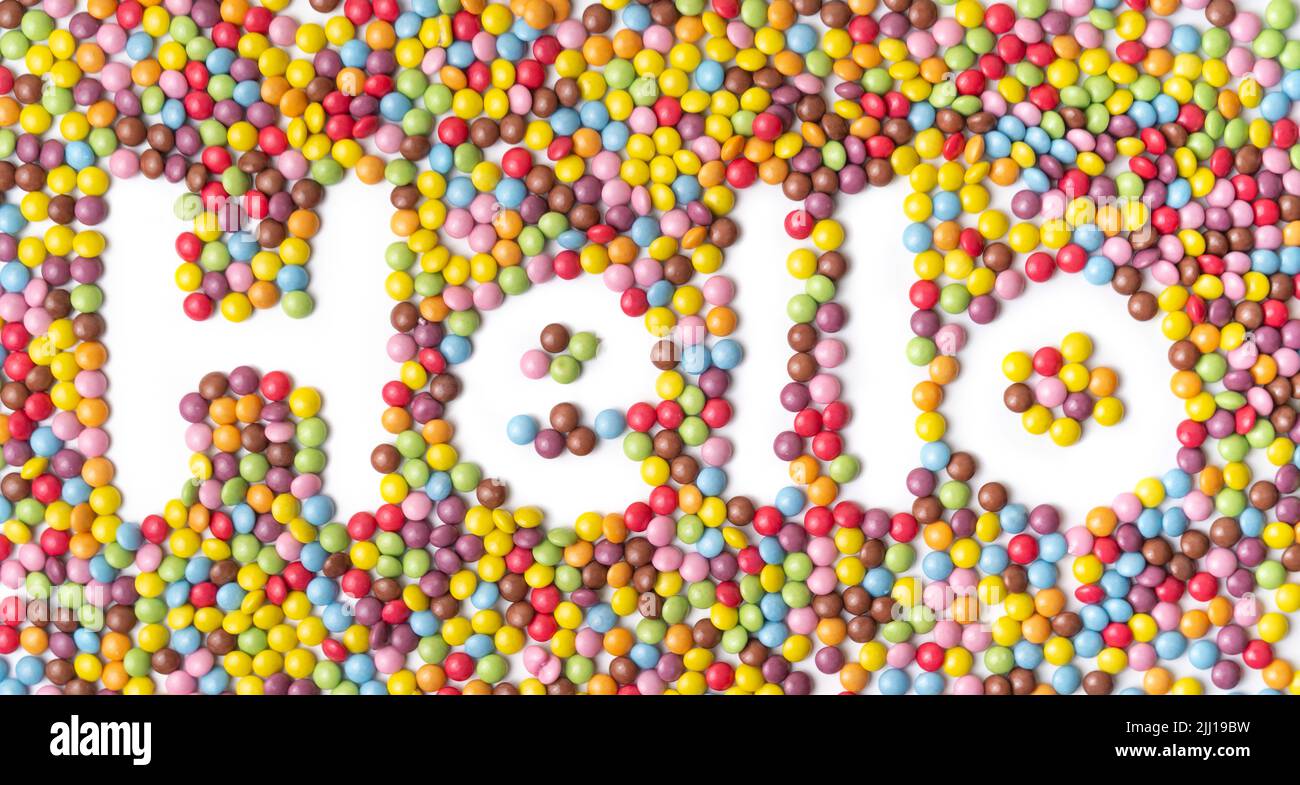 Bonbons colorés dans le texte BONJOUR Banque D'Images