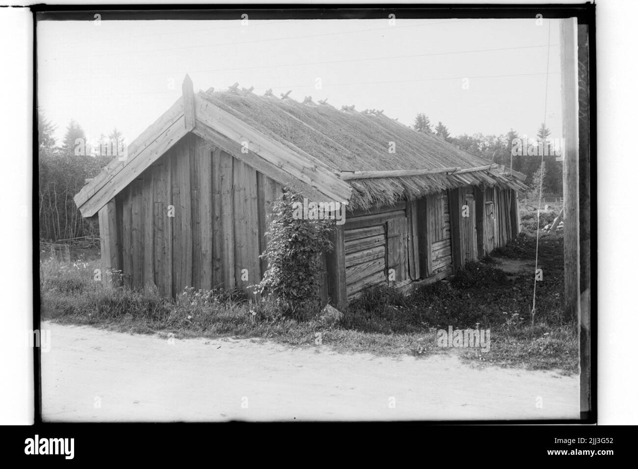 Ligin -grange temporisée avec toit en vase, bâtiment à l'ancienne.axel Karlsson (pour Dahlander) Banque D'Images