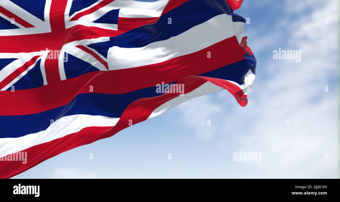 Le drapeau américain d'Hawaï agitant dans le vent par temps clair. Hawaï est un état dans l'ouest des États-Unis, situé dans l'océan Pacifique. Démocratie Banque D'Images