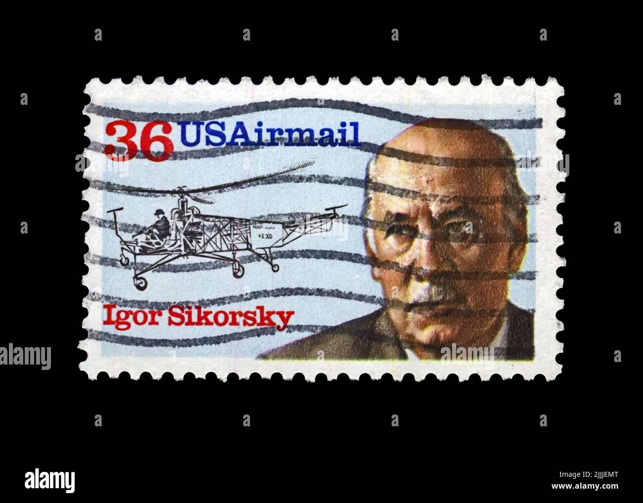 Le timbre postal imprimé aux États-Unis montre l'aviateur, le créateur de l'hélicoptère Igor Sikorsky, vers 1988. Timbre postal vintage isolé sur fond noir Banque D'Images