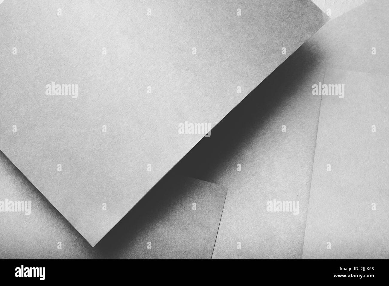 mise en page des feuilles grises monochromes abstraites de la couche de papier Banque D'Images