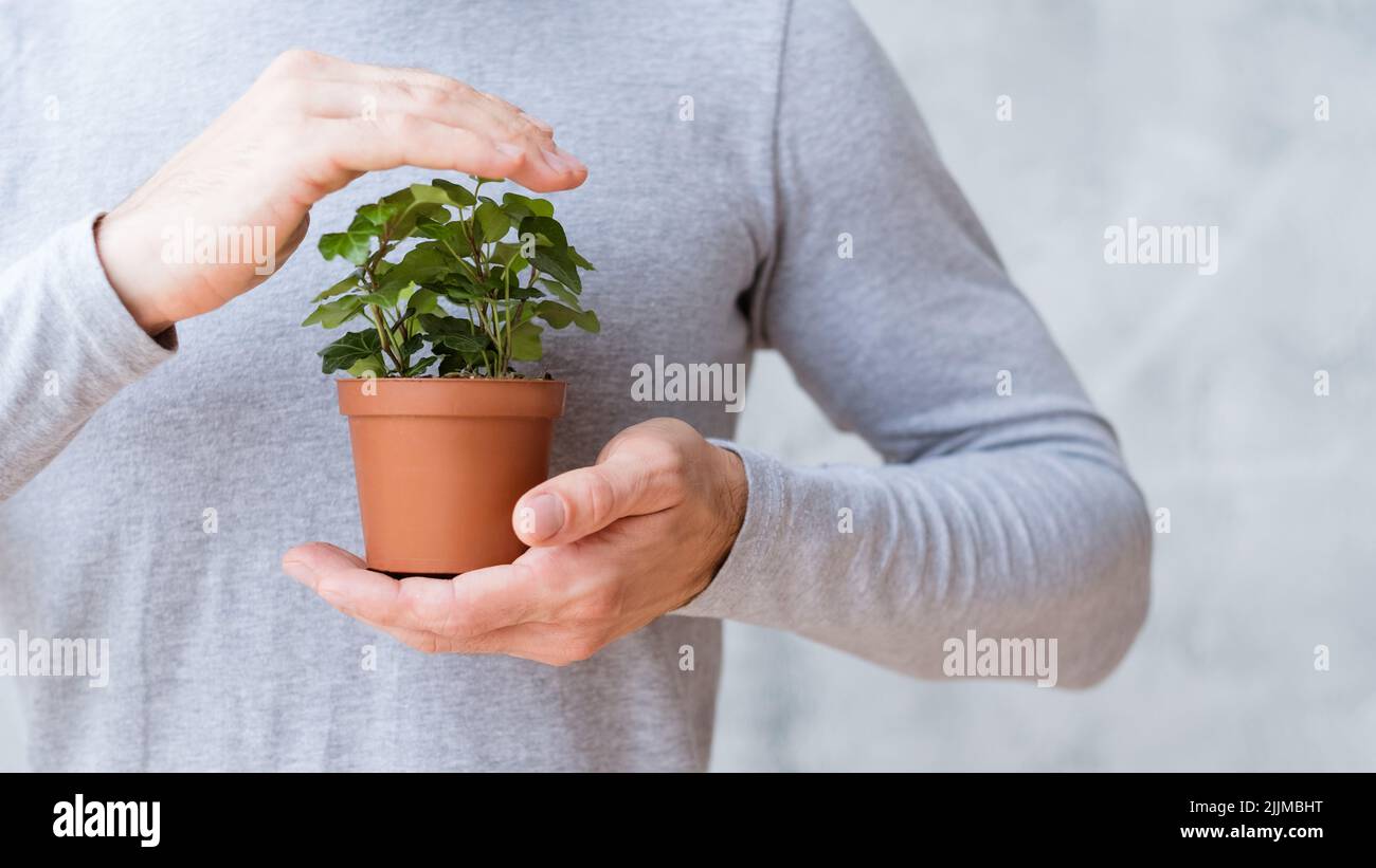 ecologie mouvement environnement homme couverture maison Banque D'Images