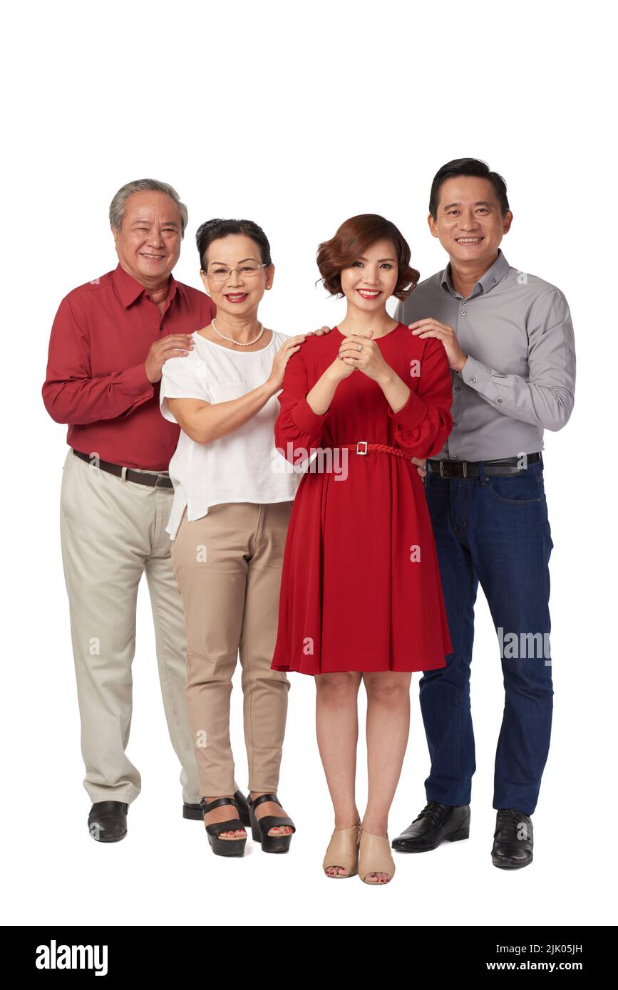 Bonne famille vietnamienne vous souhaitant bonne chance Banque D'Images