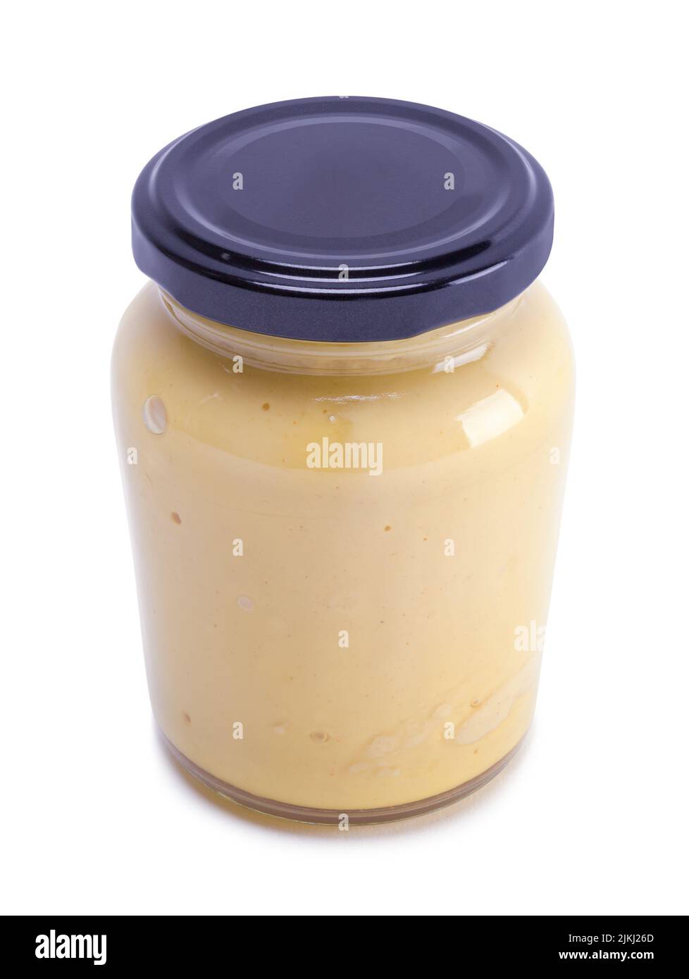Petit pot de moutarde avec espace de copie découpé sur blanc. Banque D'Images