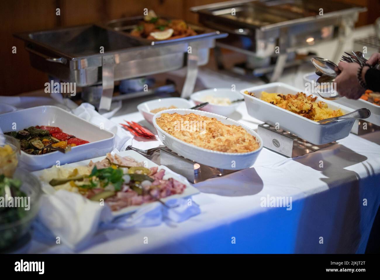 A selective focus shot of a casserole with cheese at the catering food buffet table Banque D'Images