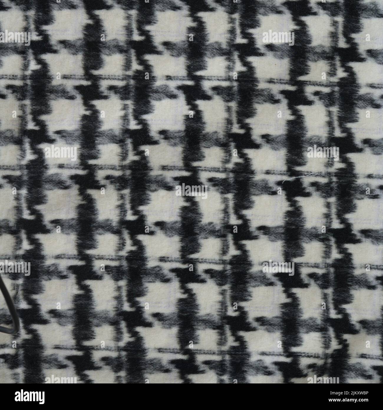 Une photo en gros plan d'un tissu en laine de pied-de-poule, parfait pour les papiers peints Banque D'Images