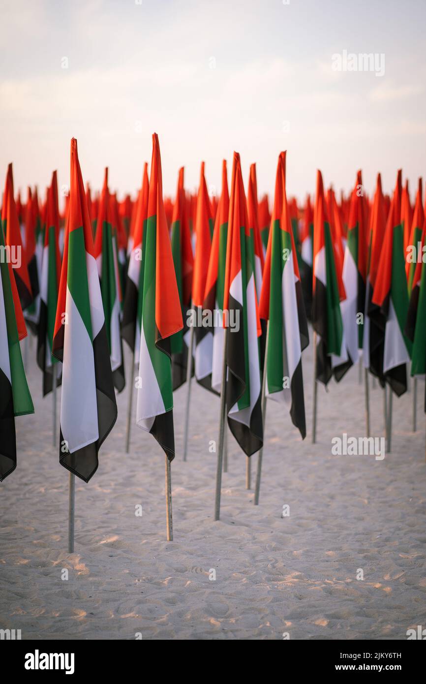 A vertical shot of a bunch of UAE flags on poles on Kite Beach in Dubai Banque D'Images