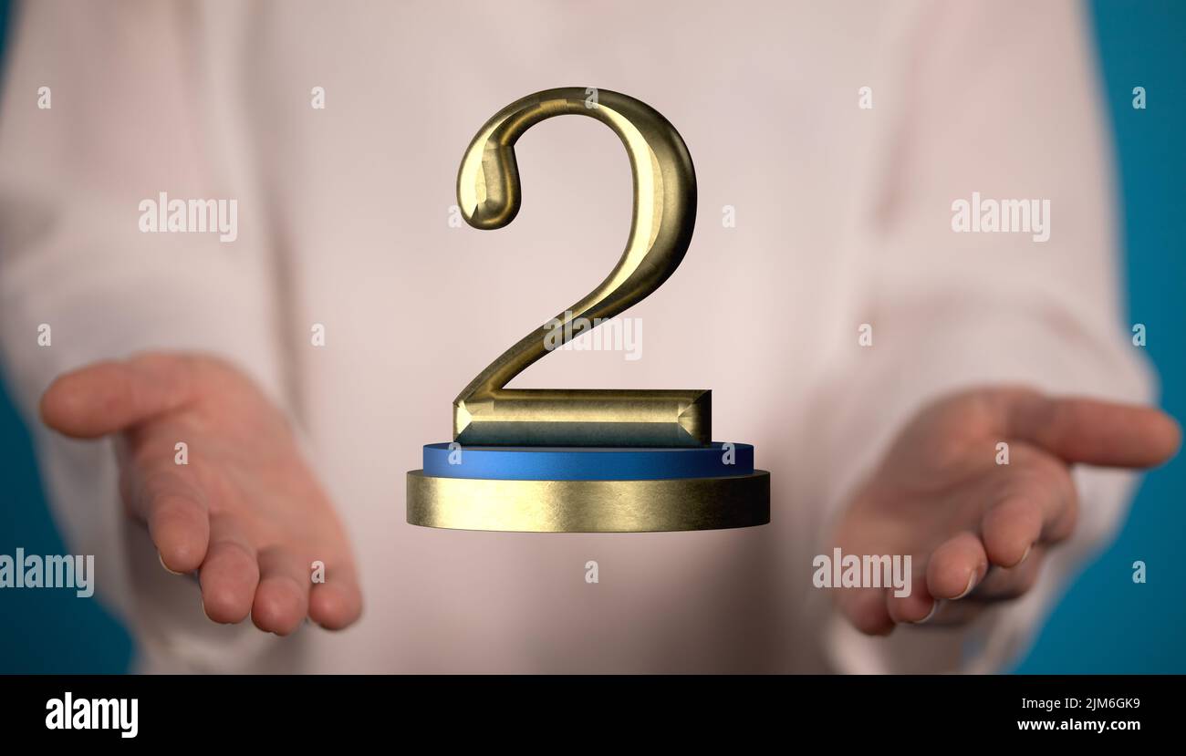 Un rendu 3D d'une deuxième place Golden Award et main mâle tenant sur un arrière-plan flou Banque D'Images