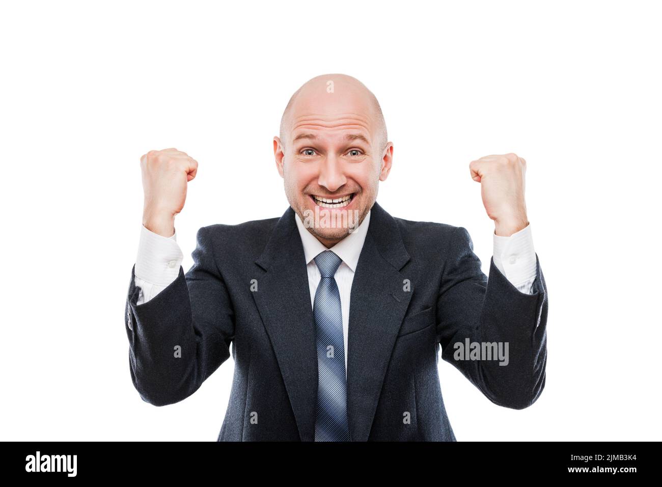 Un homme d'affaires souriant qui se fait le bonheur de fêter la victoire Banque D'Images