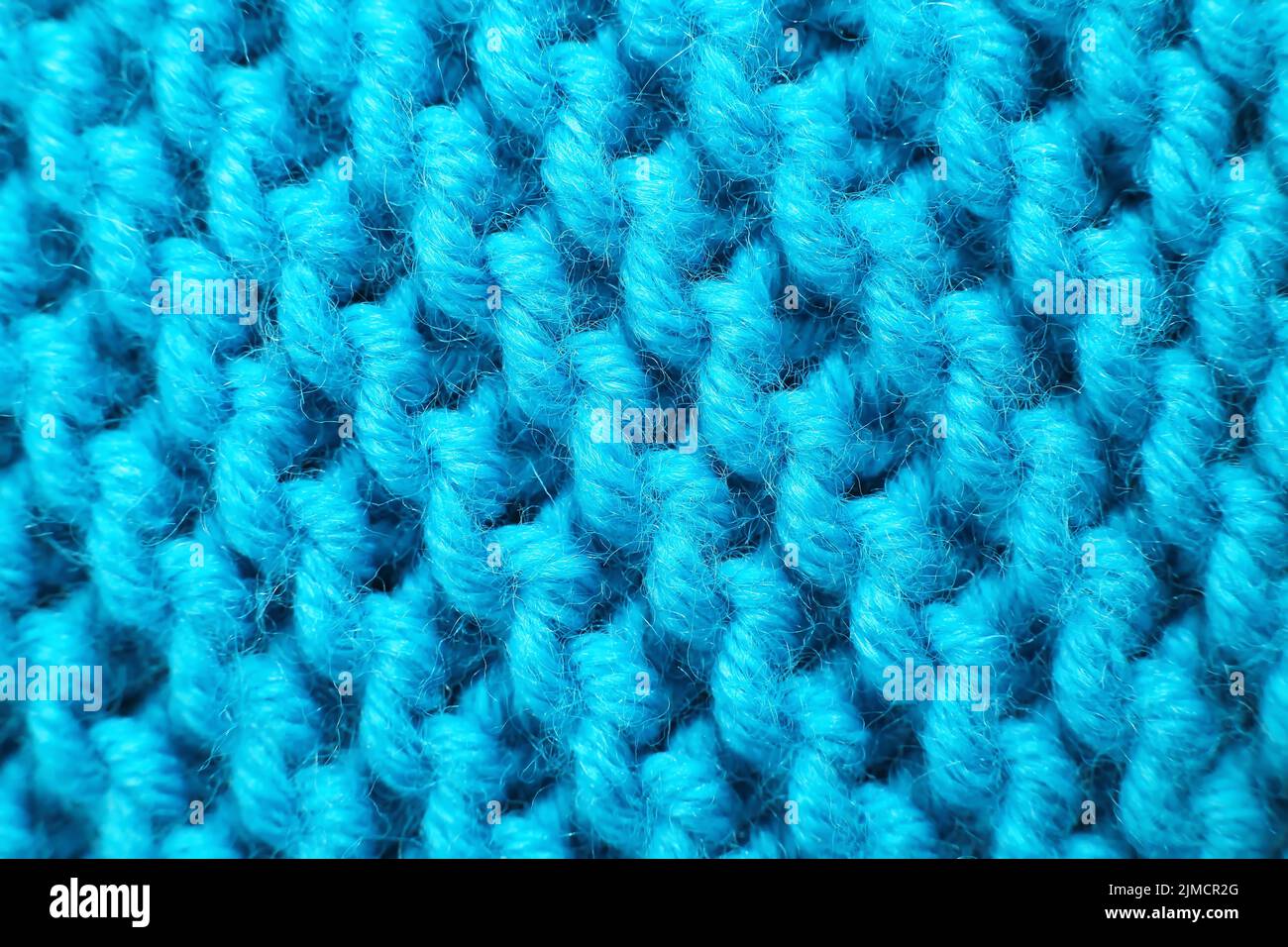 Couverture en laine tricotée de couleur magenta. Macro Banque D'Images
