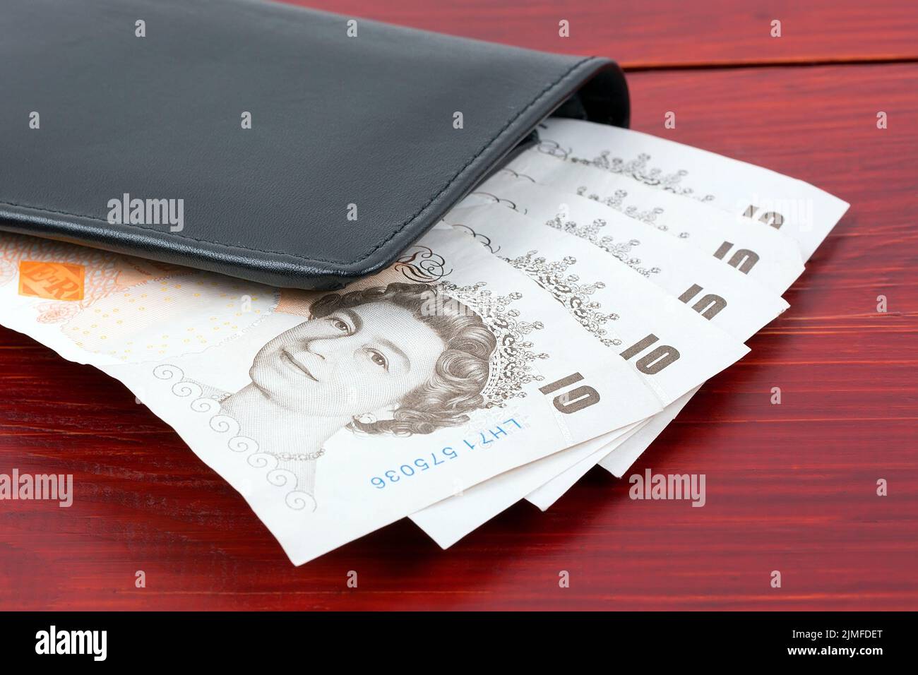 Livres anglais dans le portefeuille noir Banque D'Images