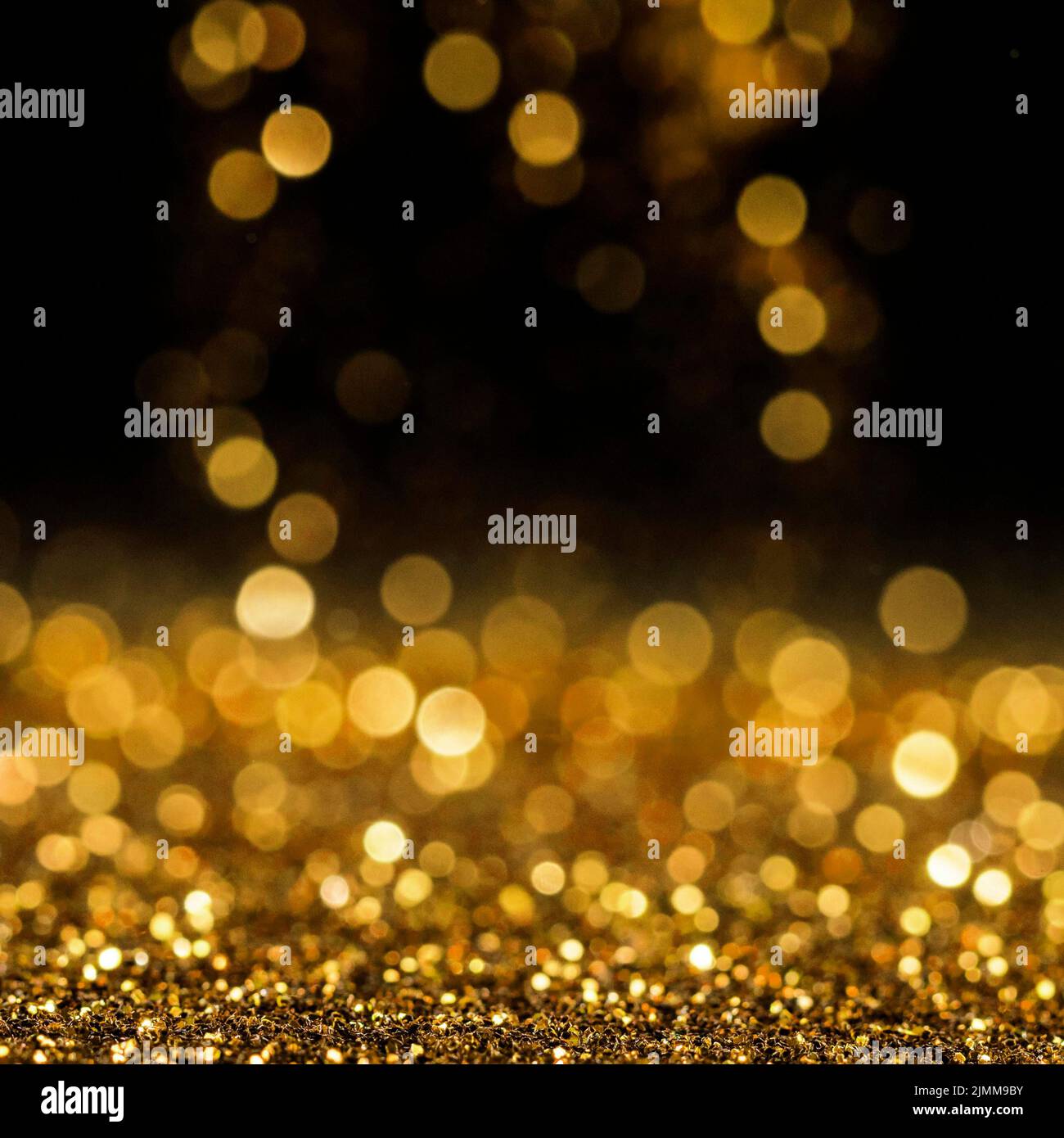 Paillettes dorées réfléchissantes Banque D'Images