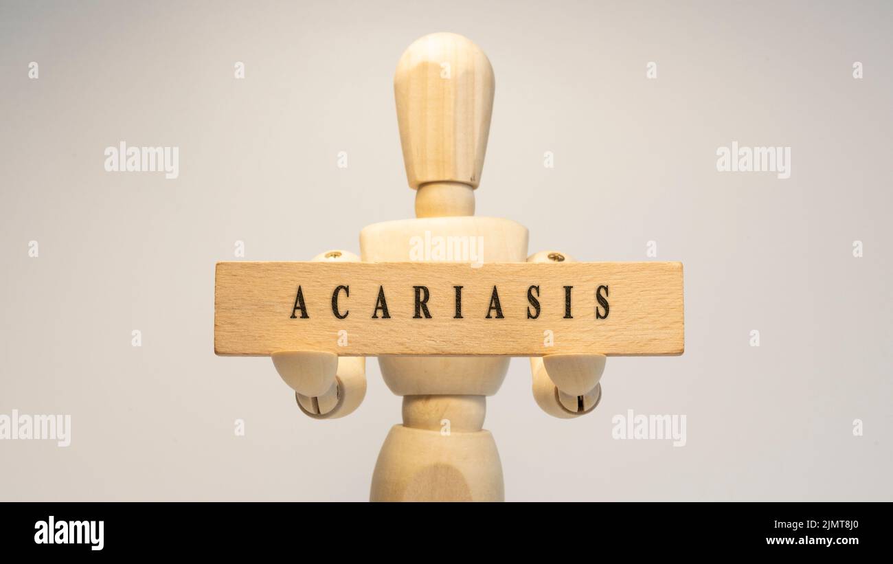 Maladie d'Acariasis écrit sur surface en bois. Concept de santé. Banque D'Images