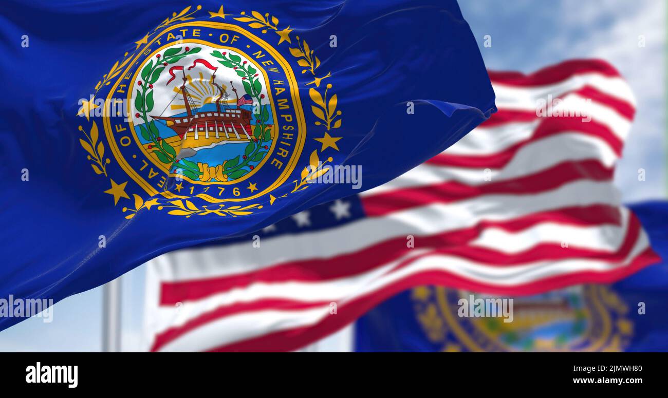 Le drapeau de l'État du New Hampshire agité avec le drapeau national des États-Unis d'Amérique Banque D'Images