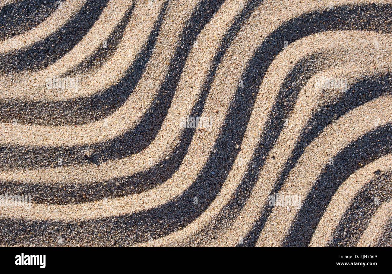 Motif ondulé de plage naturelle de sable fond pour les dessins d'été Banque D'Images