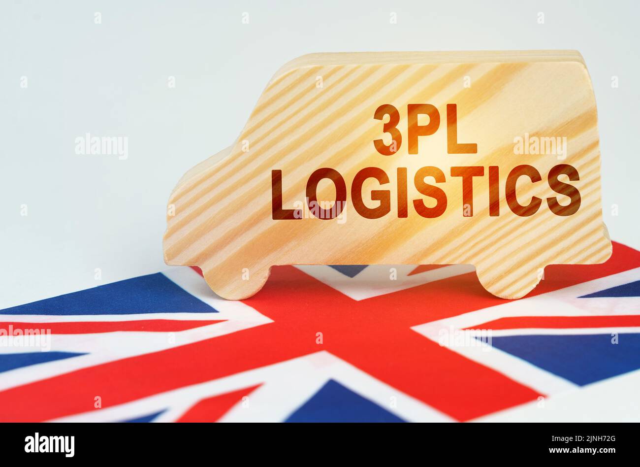 Le concept du transport de marchandises et de la logistique. Sur le drapeau de la Grande-Bretagne il y a un camion avec une inscription - 3PL logistique Banque D'Images