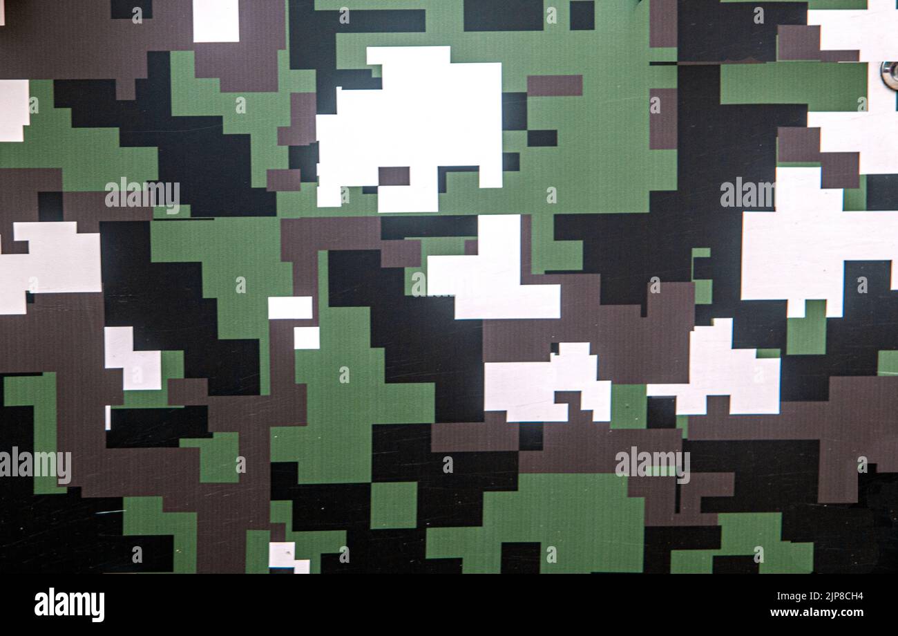 Motif de camouflage militaire vert, vert, noir, blanc et taches brunes Banque D'Images