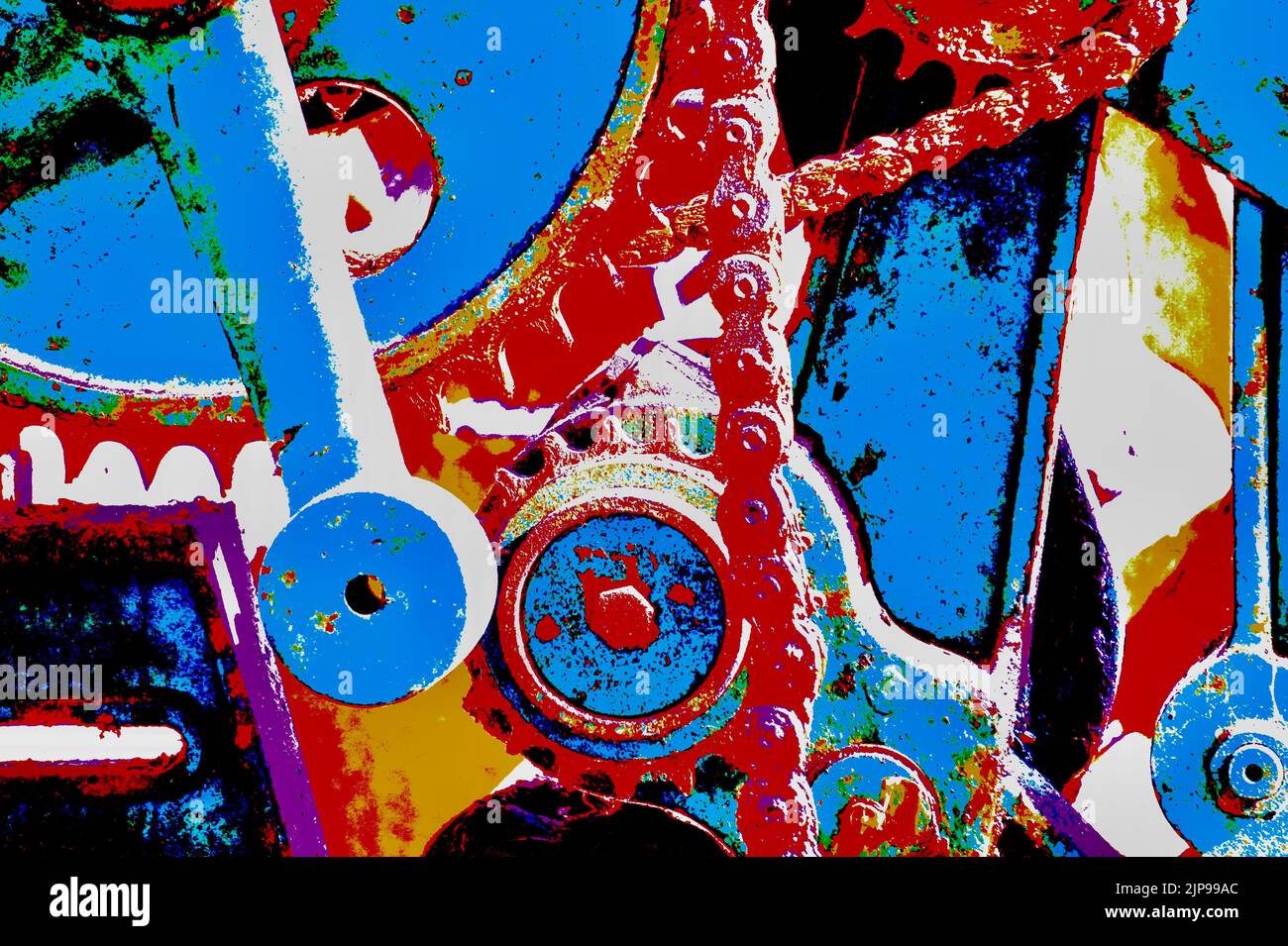 pièces d'une machine en gros plan avec roues à crémaillère et chaînes d'entraînement colorées principalement en rouge et bleu Banque D'Images