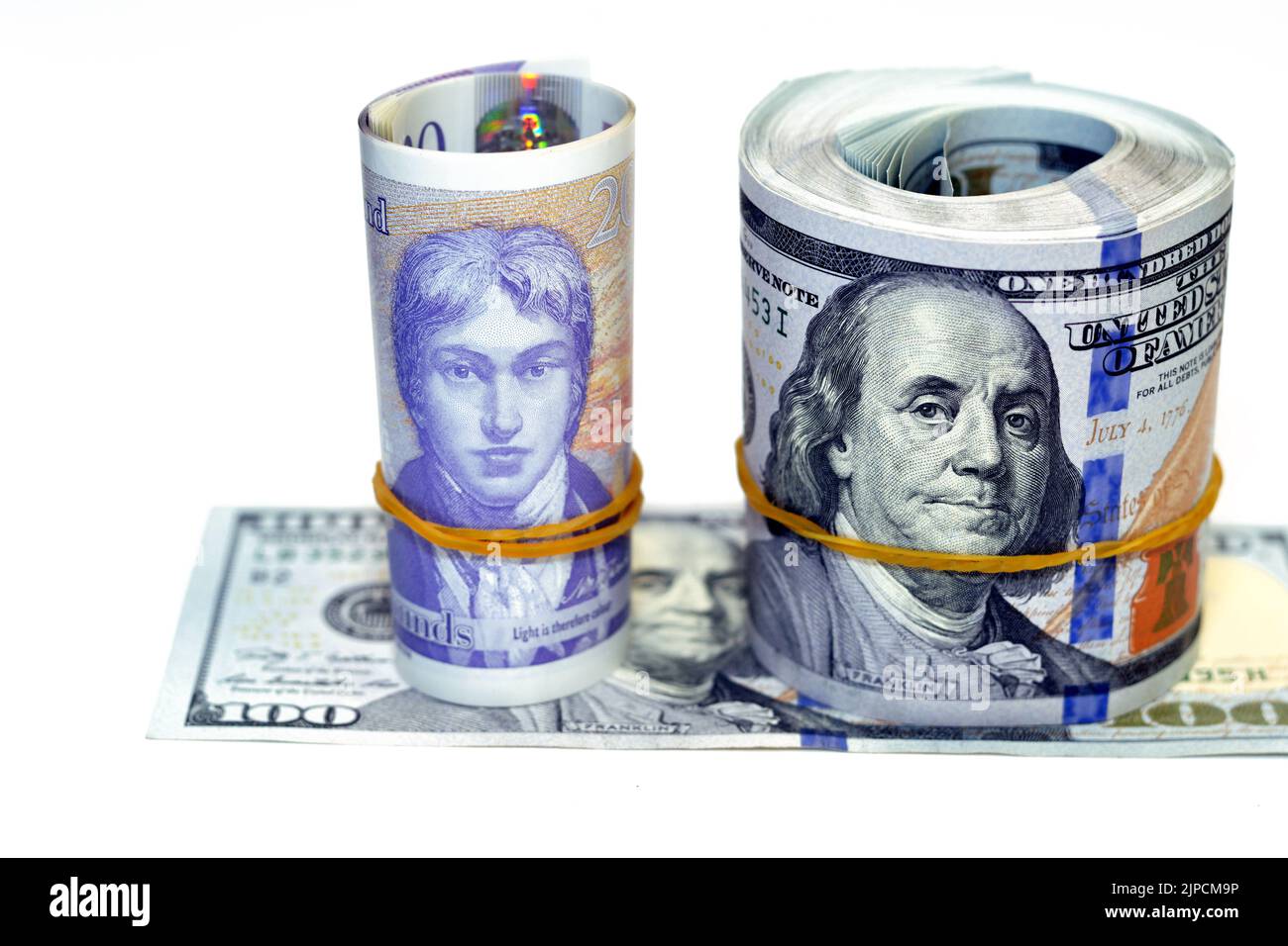 Rouleaux d'argent de 100 $ cent billets en dollars US billets en espèces avec £20 vingt livres en espèces billets en polymère Sterling, Amérique Banque D'Images