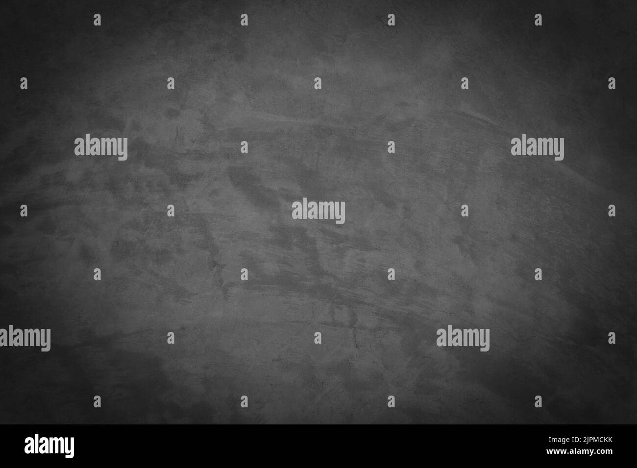 Vieux mur de ciment gris avec des fissures sur la surface. Banque D'Images