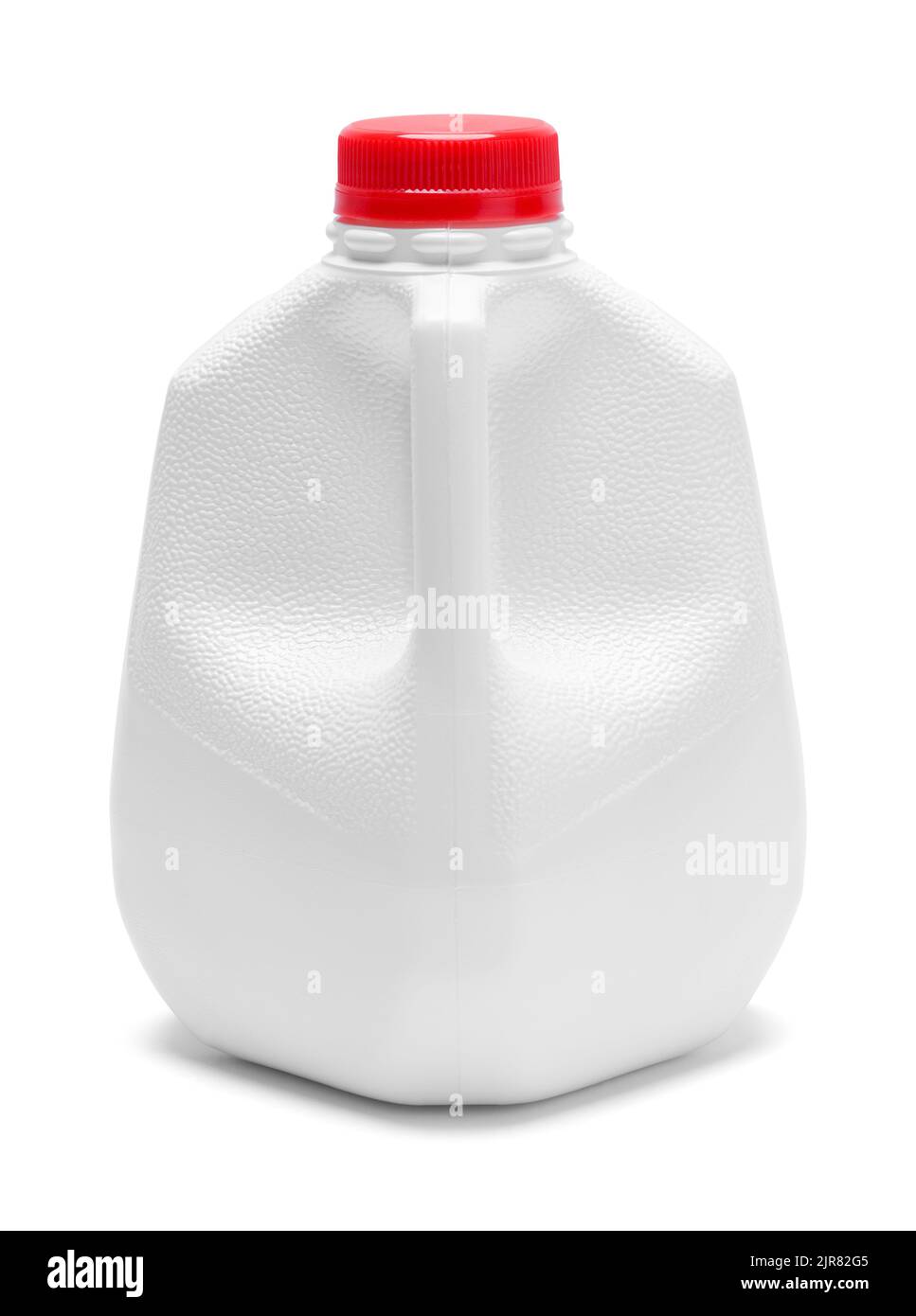 Carafe à lait en plastique découpée sur le blanc. Banque D'Images