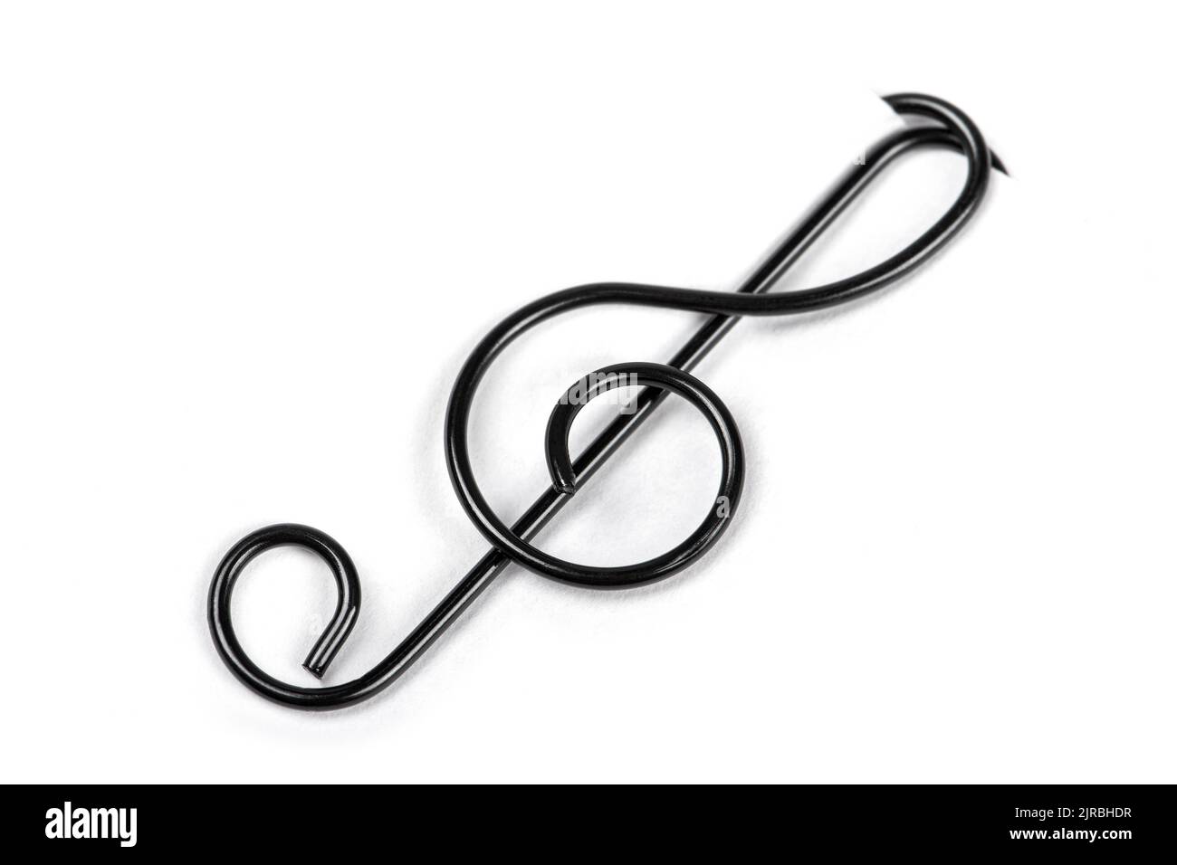 Fente d'aigus noirs sur fond blanc. Symbole de musique Banque D'Images