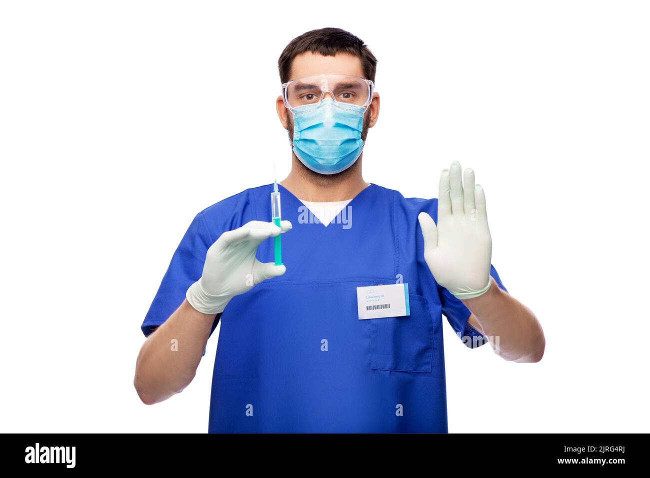 médecin masculin dans un masque et des gants avec une seringue Banque D'Images