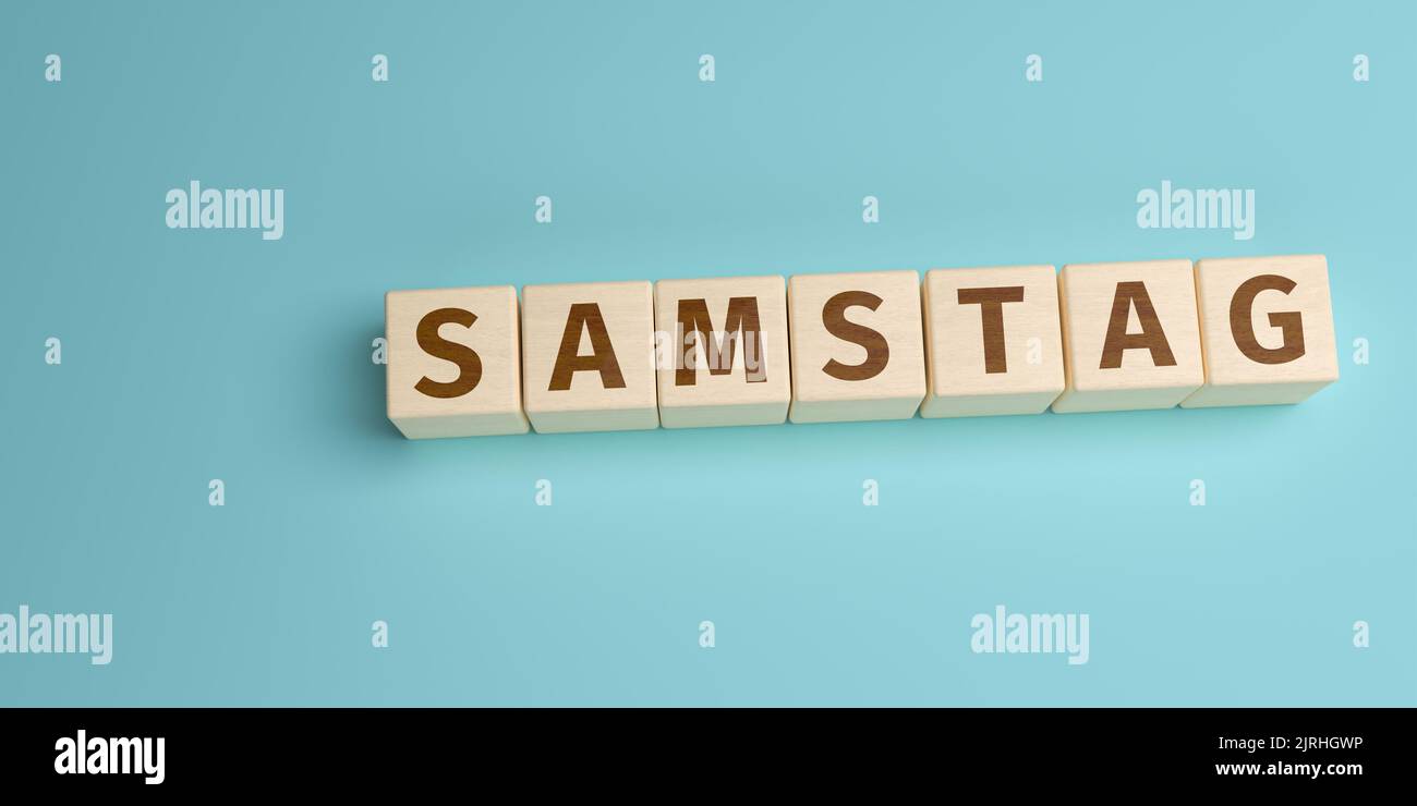 Le mot allemand Samstag (samedi) construit à partir de lettres sur des cubes en bois. Vue grand angle avec espace de copie Banque D'Images