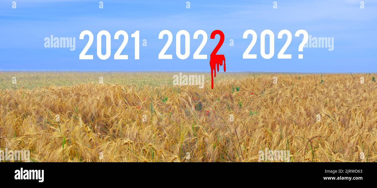 Années 2021 2022 et 202? sur le champ de blé jaune et ciel bleu. Le nombre 2 sur 2022 est dans le sang. Nouvelle année 2023 concept de guerre en Ukraine Banque D'Images