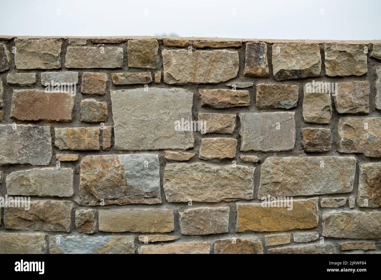 Mur en pierre beige Bricks arrière-plan, muri construit en hauteur Banque D'Images