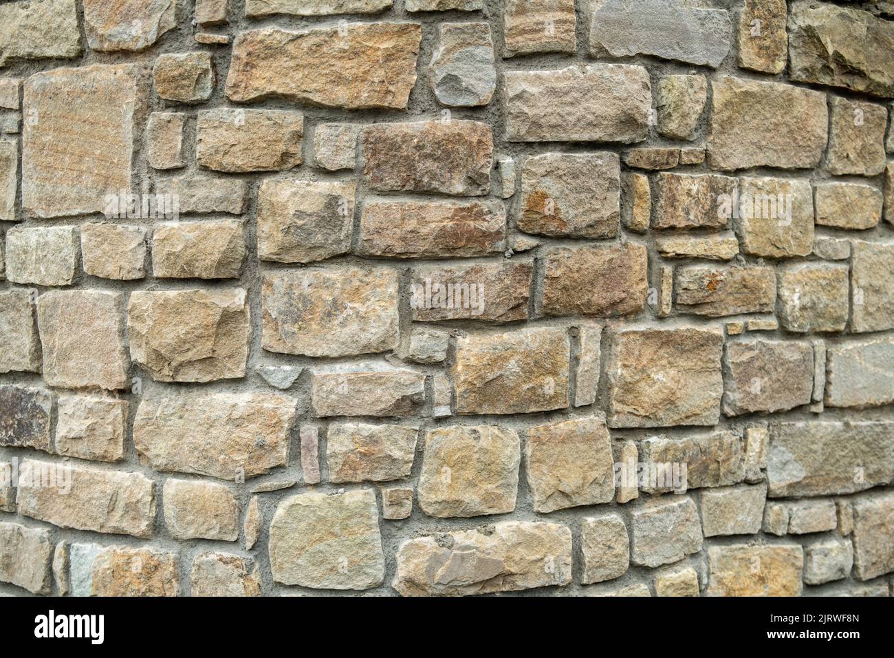 Mur en pierre beige Bricks arrière-plan, muri construit en hauteur Banque D'Images