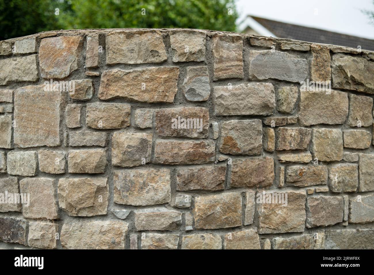 Mur en pierre beige Bricks arrière-plan, muri construit en hauteur Banque D'Images