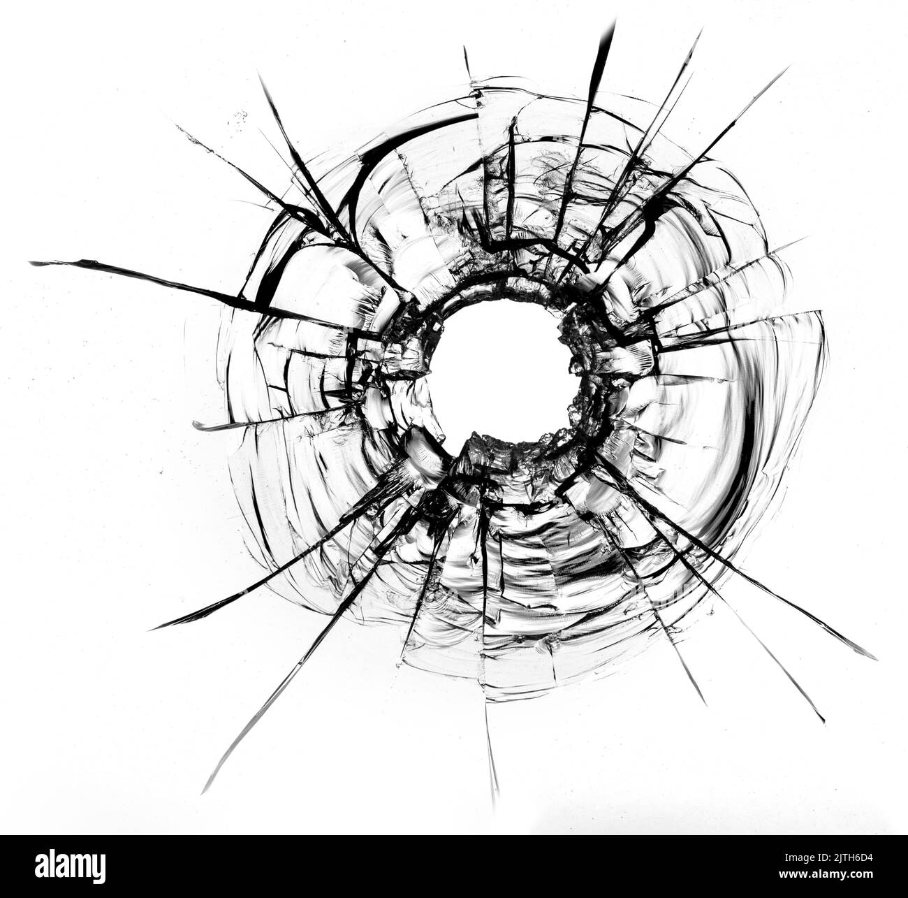 fissures dans le verre, un trou de balles dans le verre sur un fond blanc. Texture de verre de fenêtre. Banque D'Images