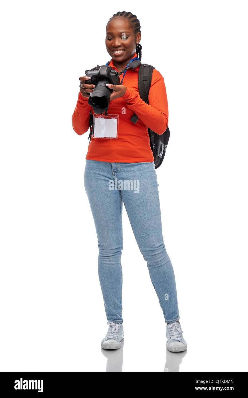 femme photographe avec caméra et id de conférence Banque D'Images