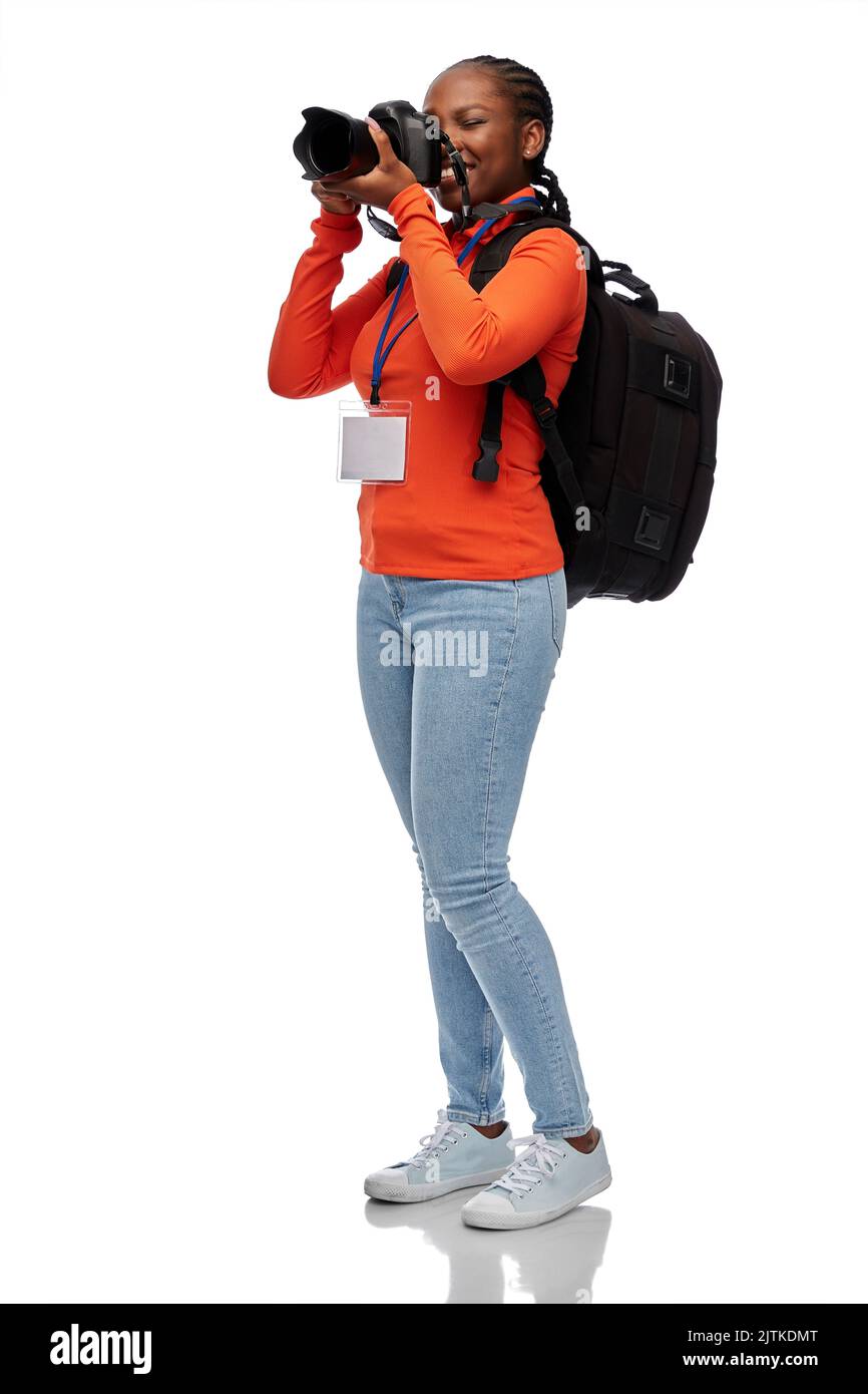 femme photographe avec caméra et id de conférence Banque D'Images