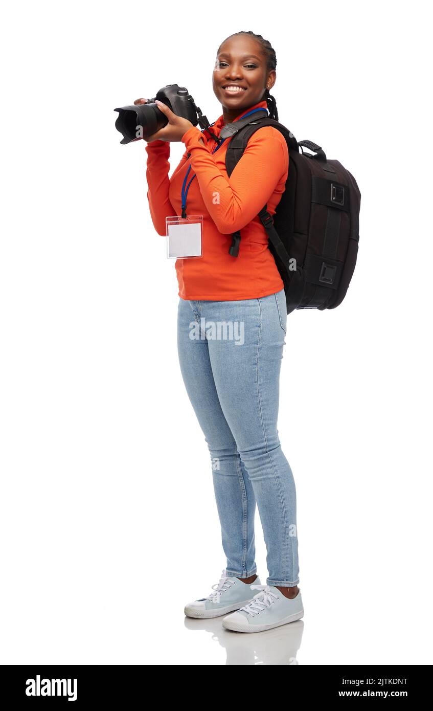 femme photographe avec caméra et id de conférence Banque D'Images