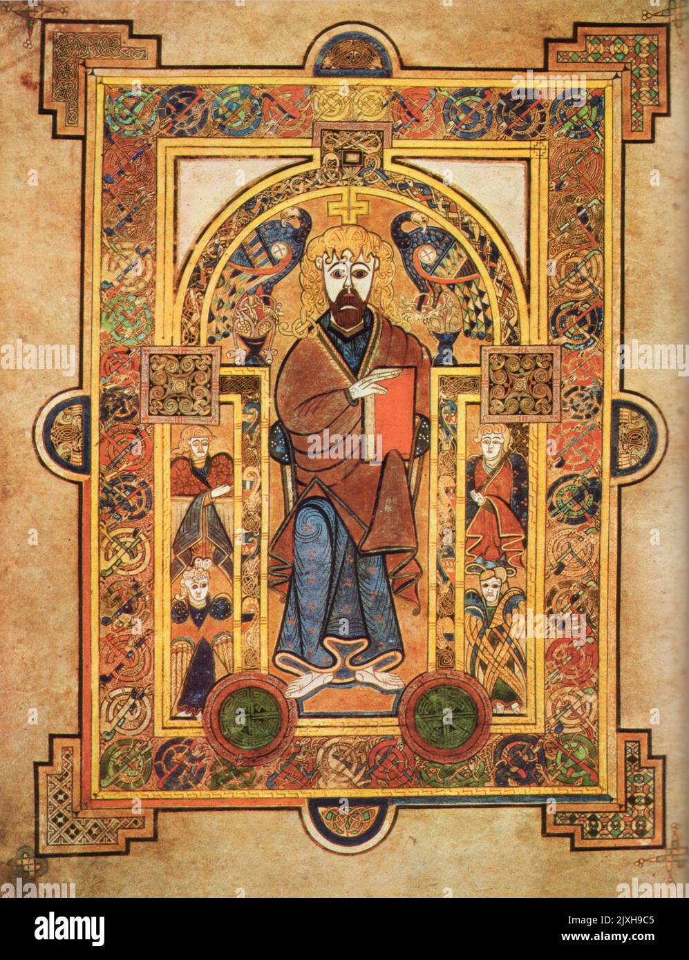 Christ enthroned du Livre de Kells (latin: Codex Cenannensis; irlandais: Leabhar Cheanannais; parfois connu sous le nom de Livre de Columba) est un livre de l'Evangile manuscrit éclairé en latin, contenant les quatre Evangiles du Nouveau Testament avec divers textes et tableaux préfets. Il a été créé dans un monastère de Columban en Irlande, en Écosse ou en Angleterre, et peut avoir reçu des contributions de diverses institutions de Columban de chacune de ces régions. On croit qu'il a été créé c. 800 AD. Banque D'Images
