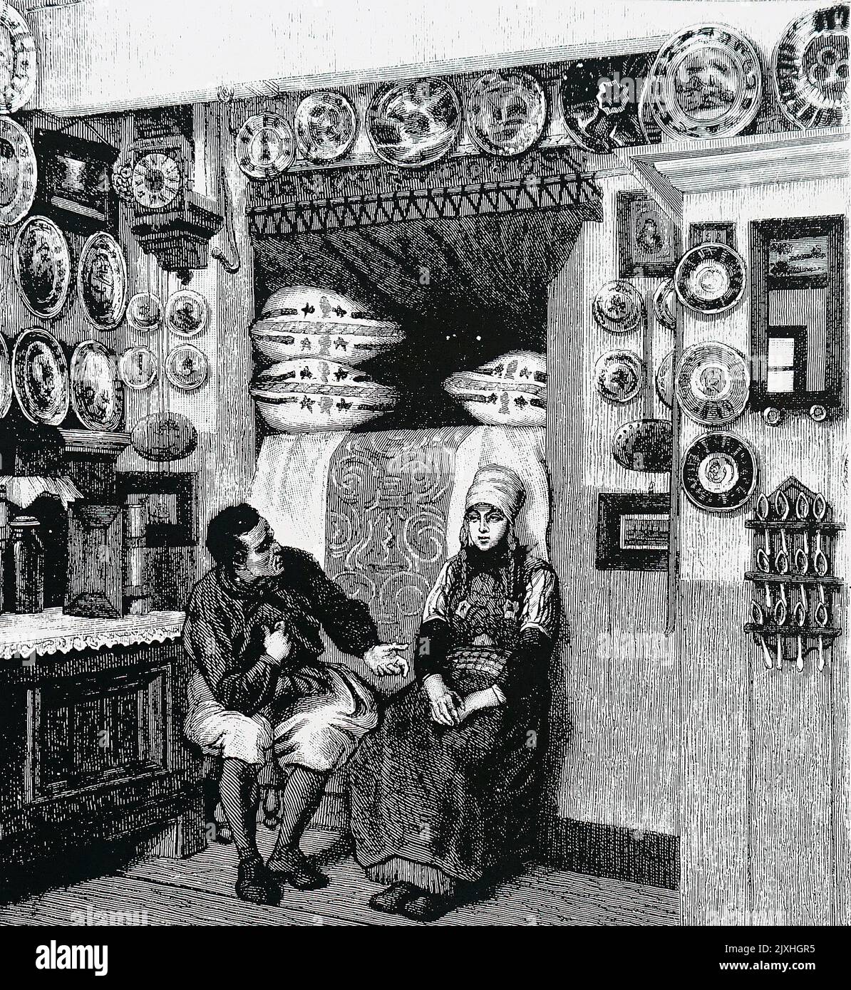 Illustration représentant l'intérieur d'une maison sur l'île hollandaise de Maaken, montrant un lit armoire derrière les deux figures. Daté du 19th siècle Banque D'Images