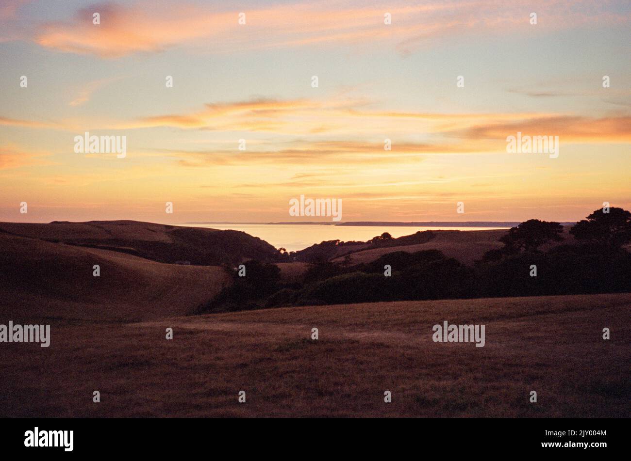 Coucher de soleil sur Hope Cove, Devon, Angleterre, Royaume-Uni. Banque D'Images