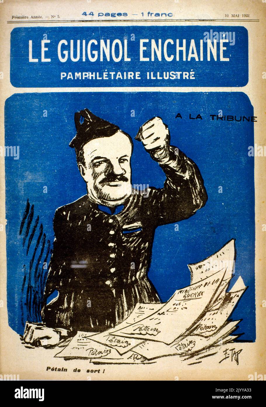 Brochure illustrée en couleur du 10 mai 1922 intitulée le Guignol Enchaine. Illustration d'un homme tenant son poing dans l'air. Banque D'Images