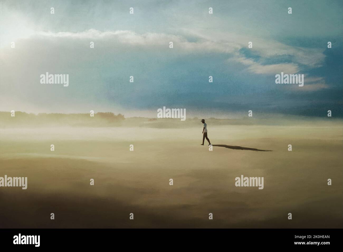 un homme solitaire marche dans un paysage désertique Banque D'Images