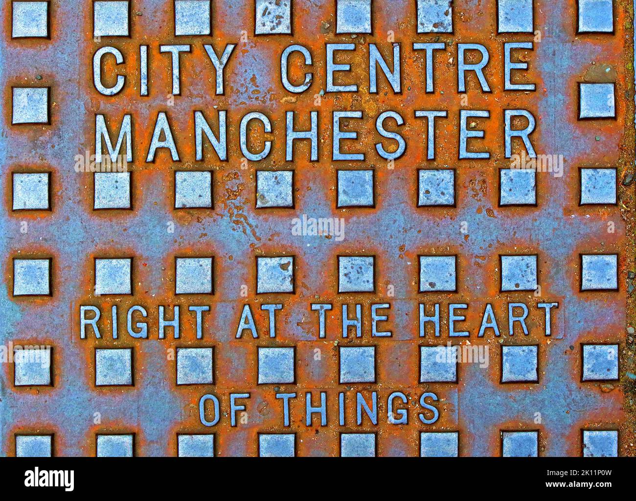 Centre-ville de Manchester, au cœur des choses, grille en fonte gaufrée, Manchester, Lancashire, Angleterre, Royaume-Uni, M1 1SH Banque D'Images