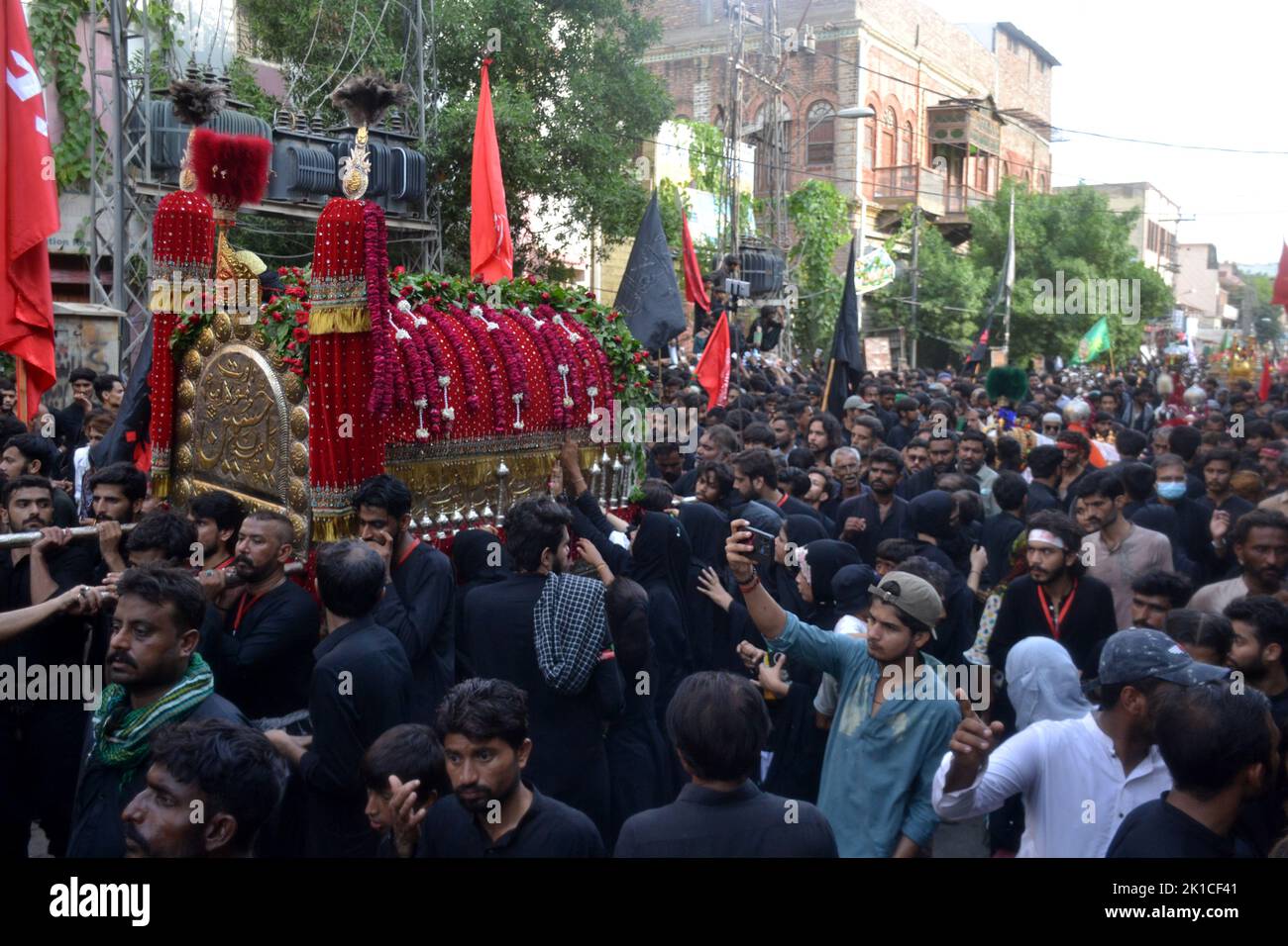A large number of mourners attend the Chehlum procession to commemorate ...