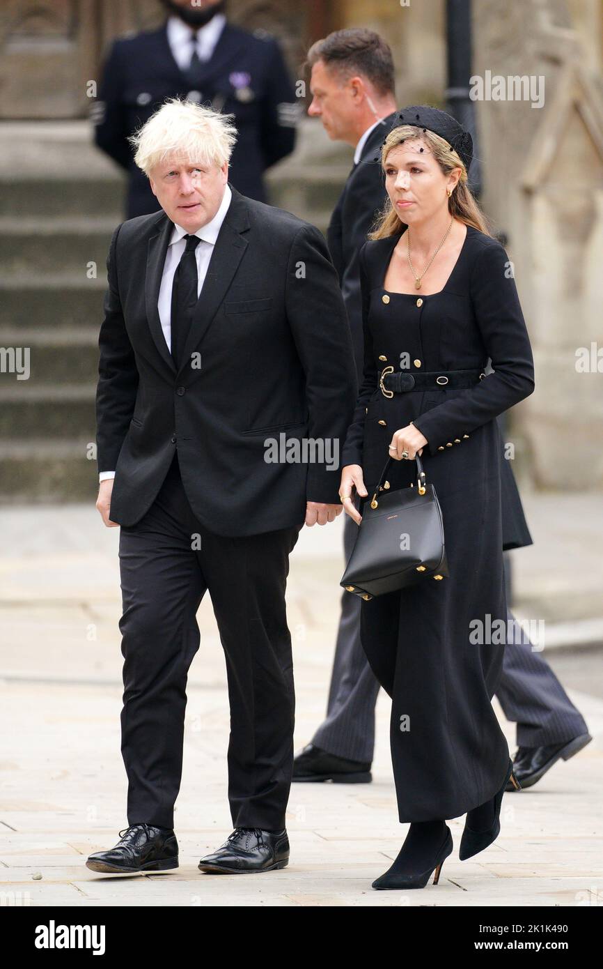 L'ancien premier ministre Boris Johnson et son épouse Carrie Johnson arrivent au funérailles d'État de la reine Elizabeth II, qui s'est tenu à l'abbaye de Westminster, à Londres. Date de la photo: Lundi 19 septembre 2022. Banque D'Images