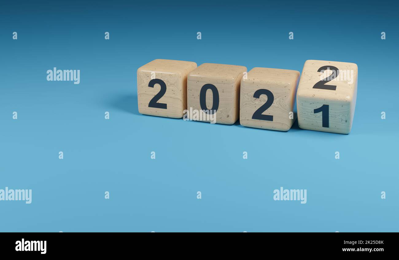 Retournement de cubes en bois avec le numéro d'année 2021 et 2022, concept du nouvel an Banque D'Images