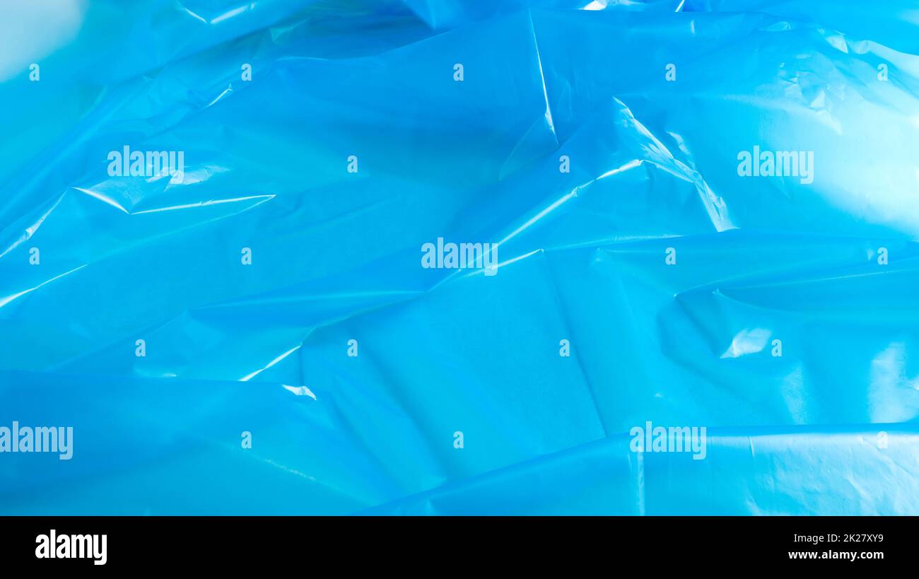 Texture et arrière-plan du sac en plastique bleu. Un sac qui est conçu pour accueillir les ordures dans lui et est utilisé à la maison et placé dans divers conteneurs à ordures. Banque D'Images