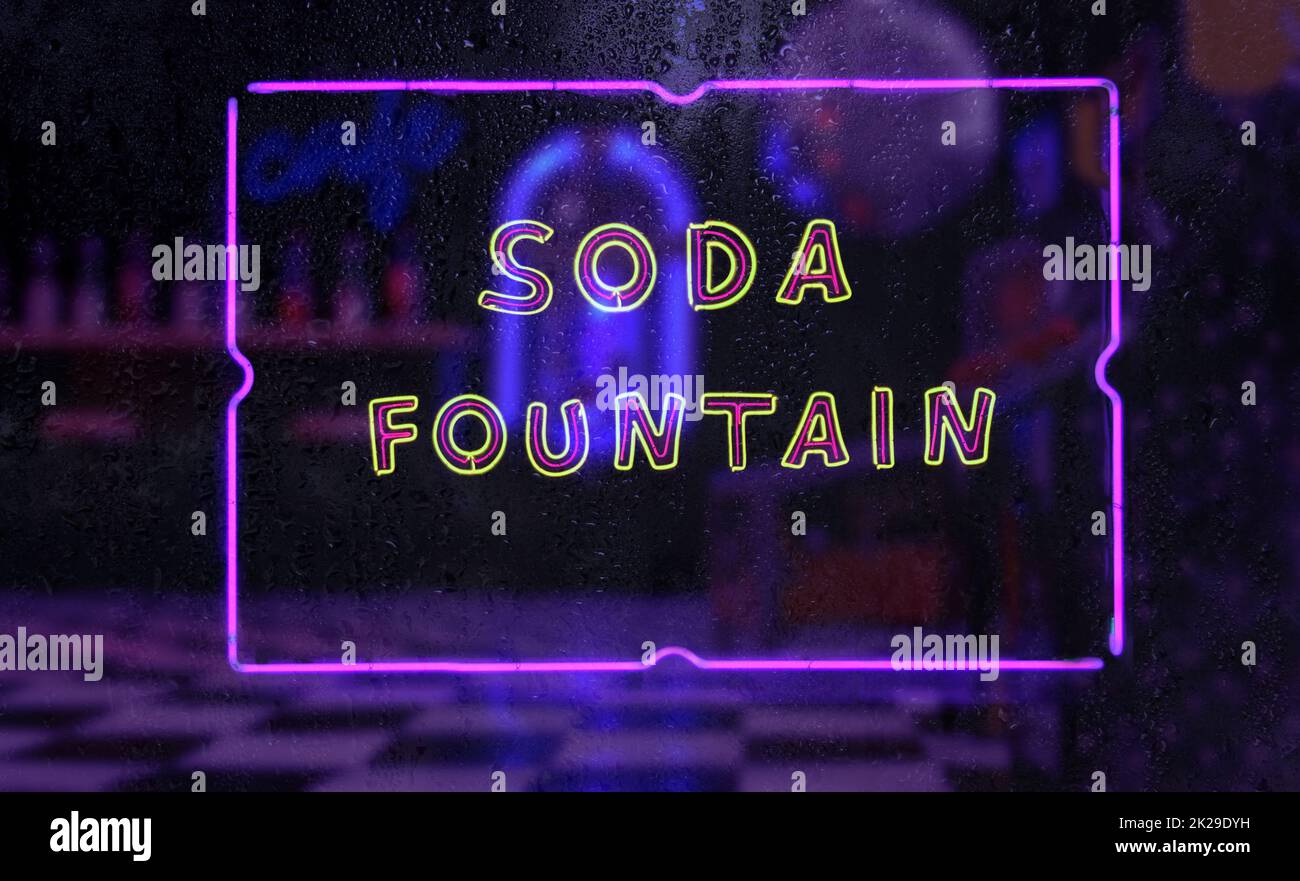 Panneau « soda Fountain Neon » dans la fenêtre à pluie Banque D'Images