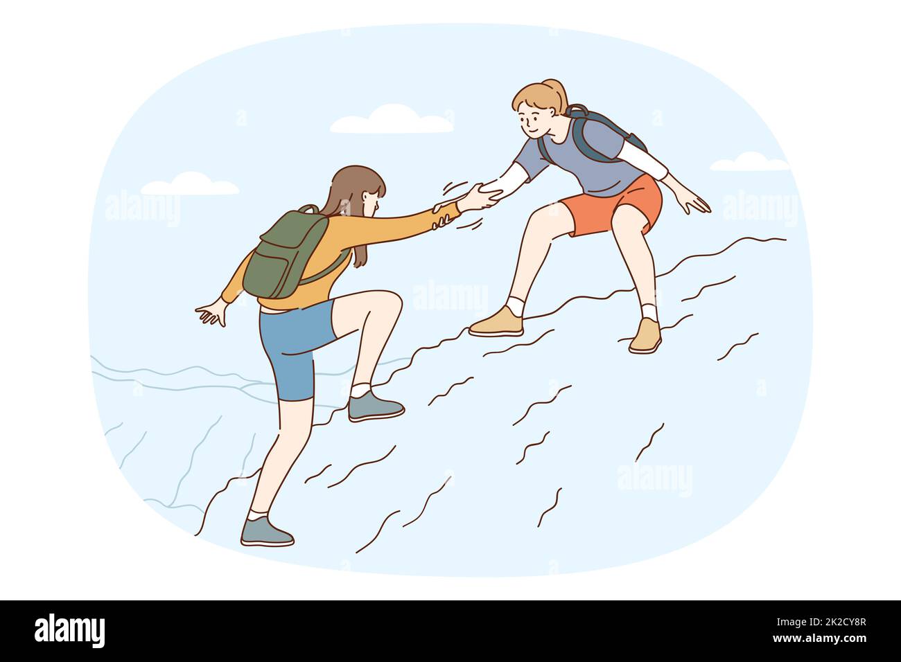 Une fille aide un ami qui escalade la montagne ensemble Banque D'Images