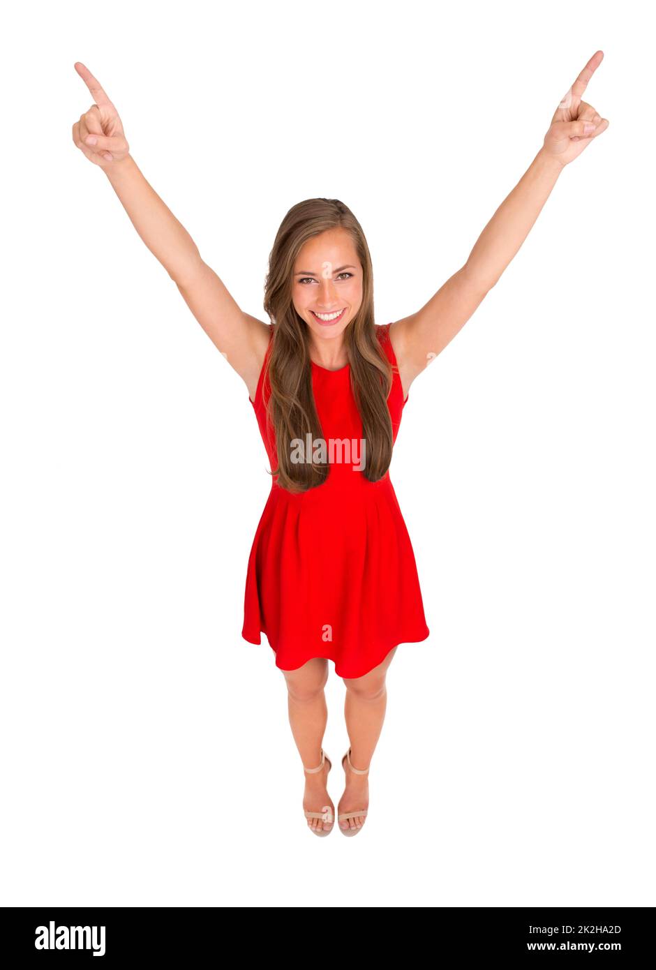 Shes a tout ce dont vous avez besoin. Photo en grand angle d'une jeune femme attrayante posant sur un fond blanc. Banque D'Images