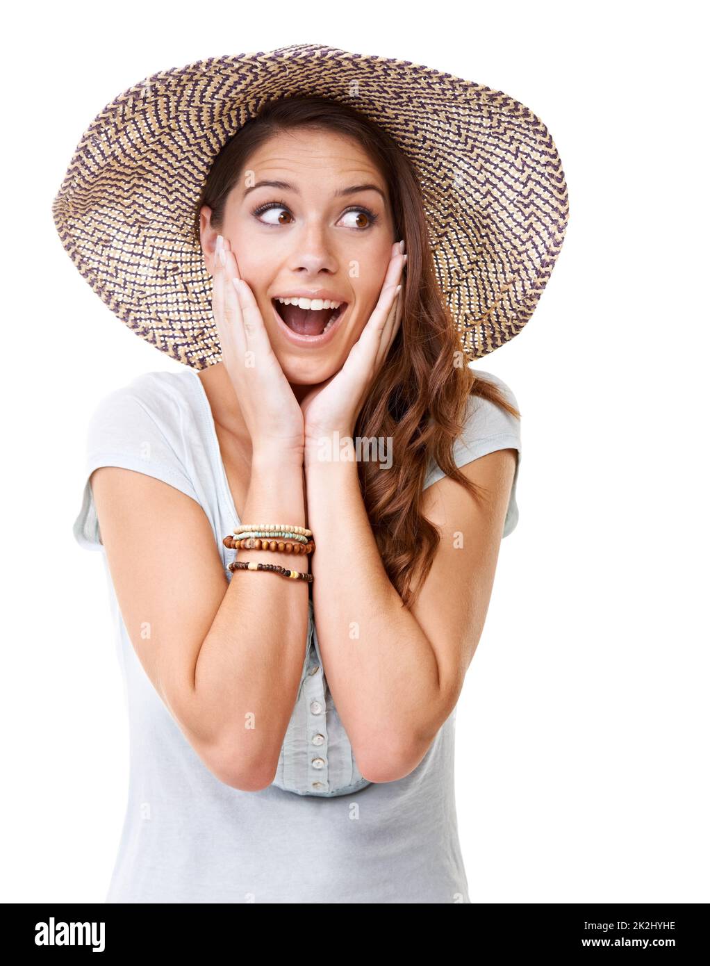 Une surprise totale. Une jeune femme surprise portant un chapeau. Banque D'Images